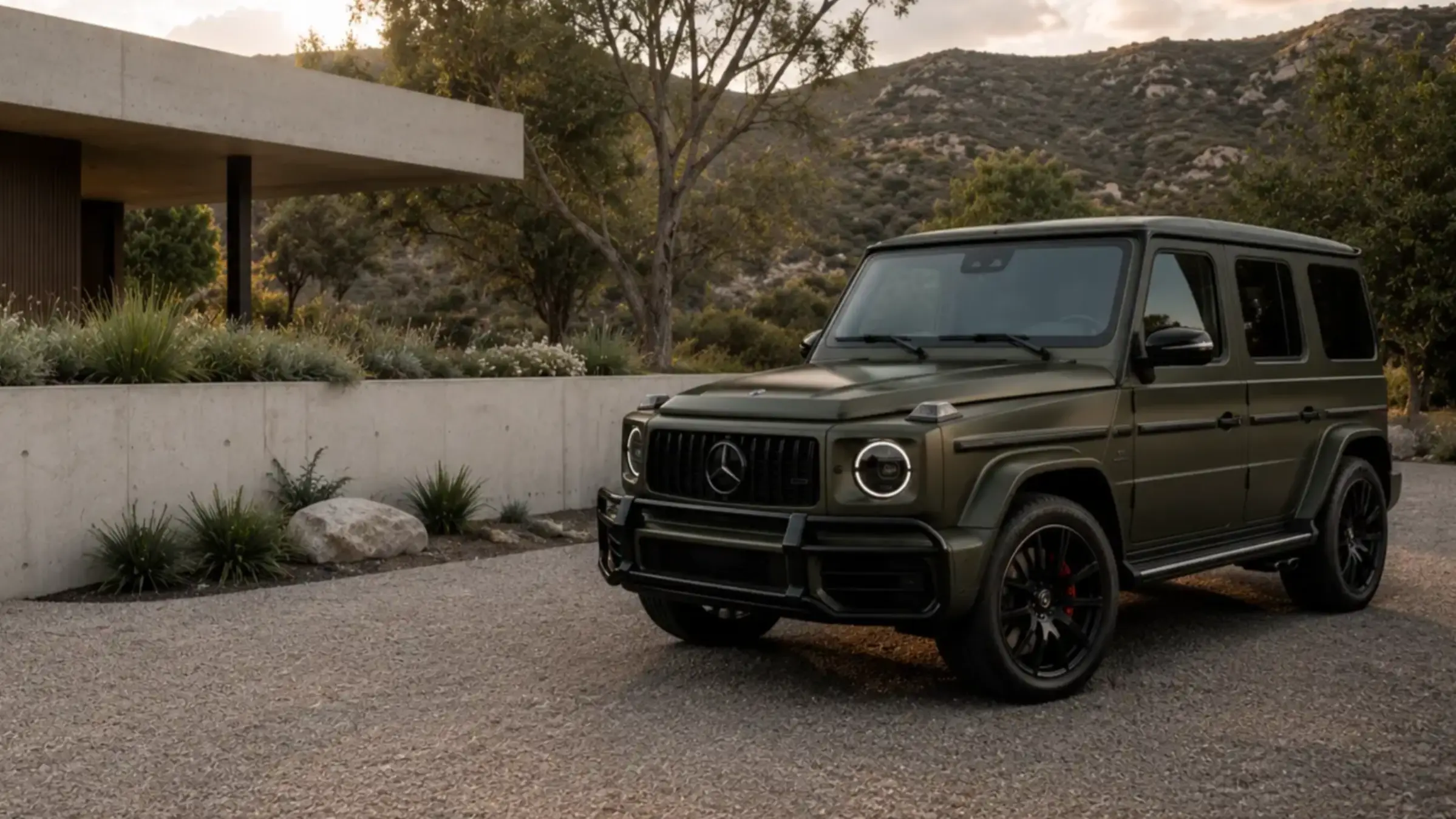 An Ascent Detail Specialist completing an arrival inspection beside a Mercedes-Benz G-Class